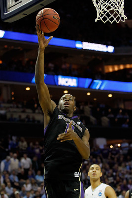 CHARLOTTE, NC - MARCH 20:  Matthew Bryan-Amaning #11 of the Washington Huskies lays the ball up while taking on the North Carolina Tar Heels during the third round of the 2011 NCAA men's basketball tournament at Time Warner Cable Arena on March 20, 2011 i