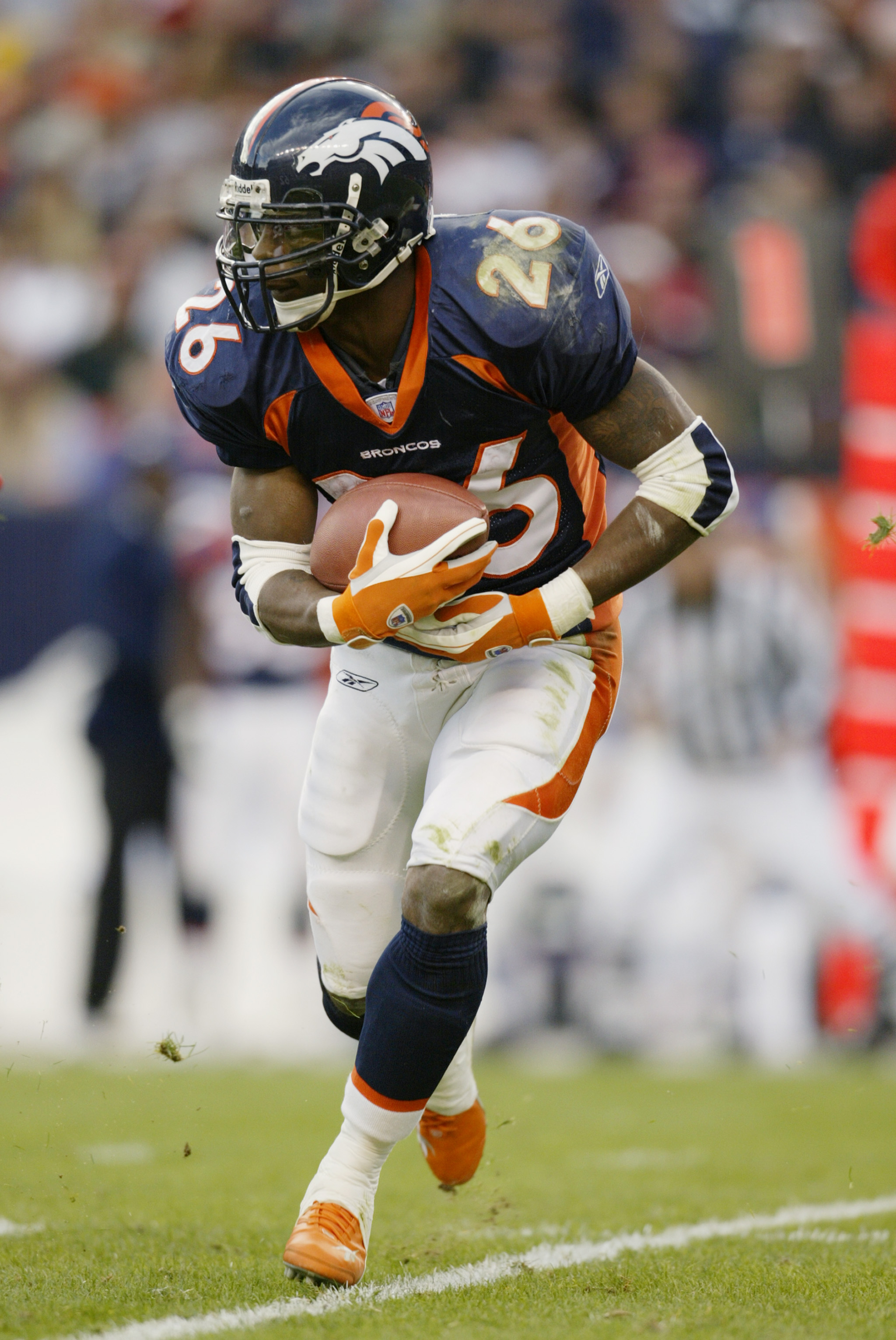 Buffalo Bills running back Fred Jackson stiff arms a Denver Broncos during  the second half at Invesco Field at Mile High in Denver on December 21,  2008. Denver failed to clinch the