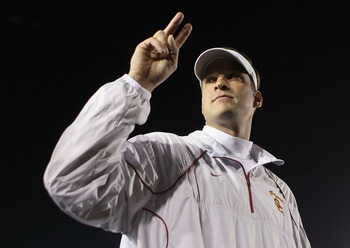 PASADENA, CA - DECEMBER 04: USC Trojans head coach Lane Kiffin celebrates following his teams victory over the UCLA Bruins at the Rose Bowl on December 4, 2010 in Pasadena, California. USC defeated UCLA 28-14. (Photo by Jeff Gross/Getty Images)