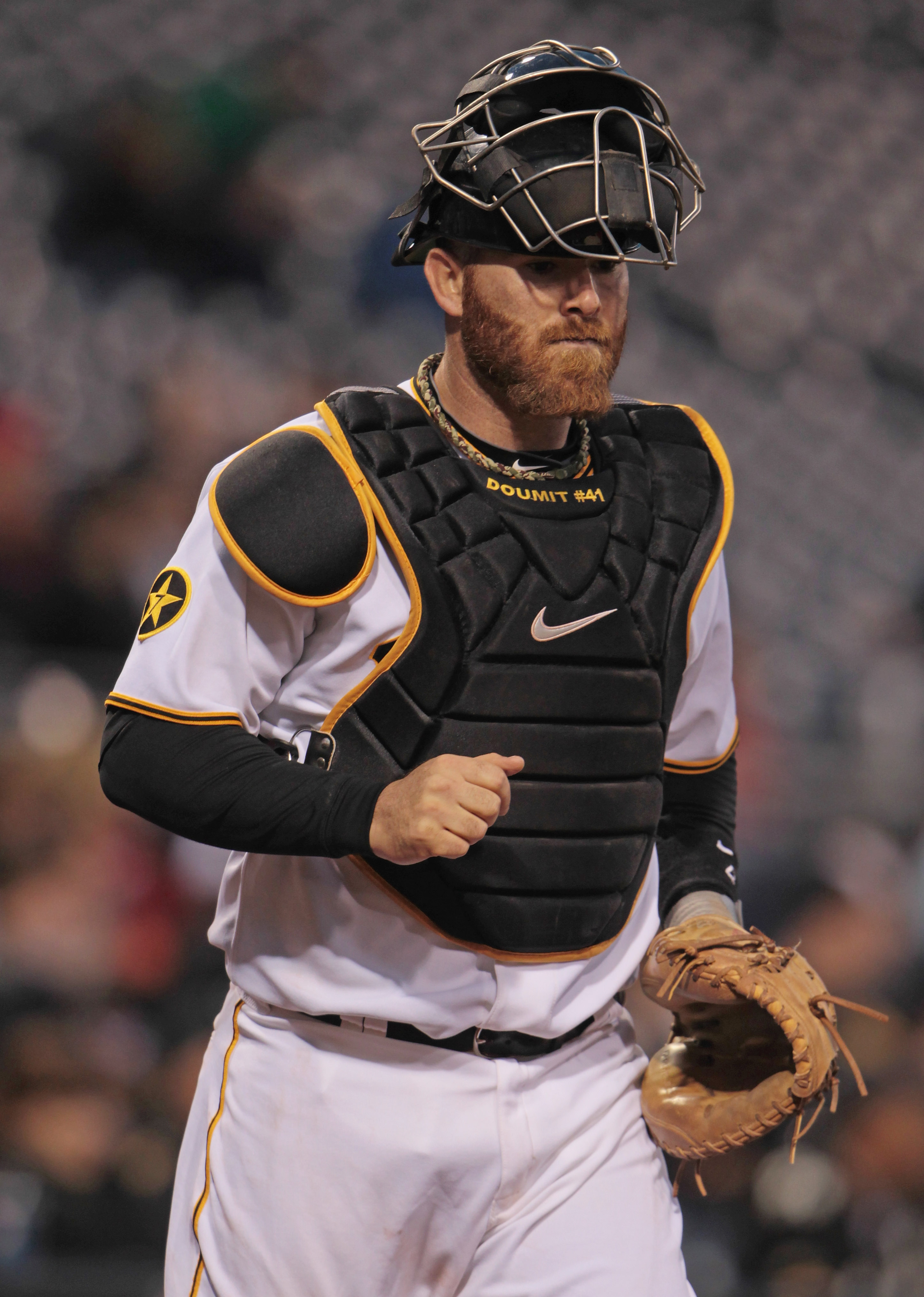 Alonso wears catcher's gear in the dugout 