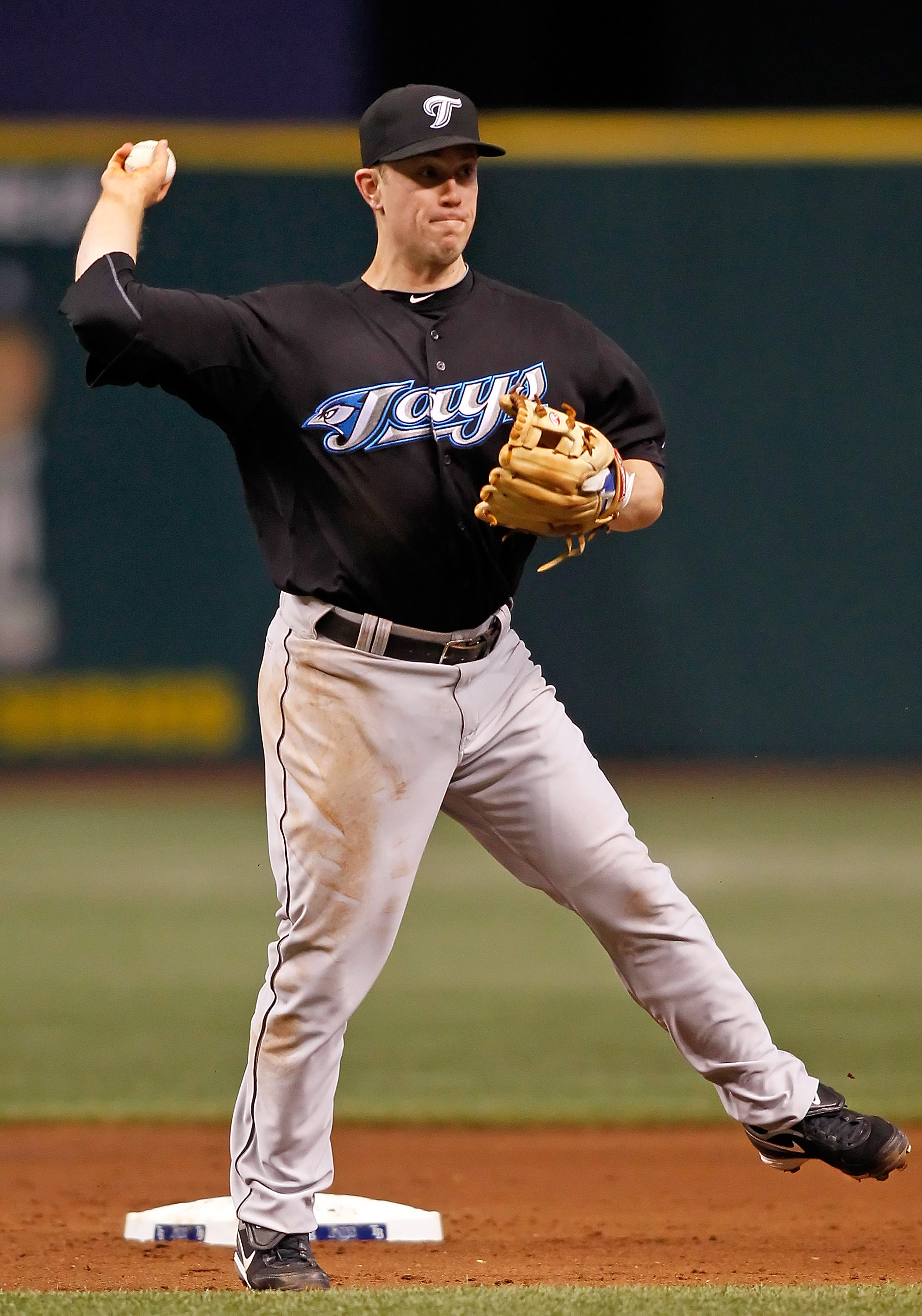 Tampa Bay Rays center fielder B.J. Upton (2) tries to make it to second  base as Toronto Blue Jays second baseman Aaron Hill (2) tags him out at the  Rogers Centre in