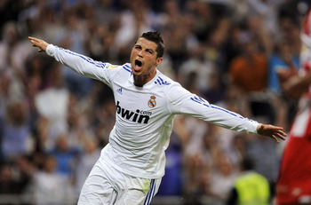 MADRID, SPAIN - MAY 21:  Cristiano Ronaldo of Real Madrid celebrates after scoring his 2nd goal during the La Liga match between Real Madrid and UD Almeria at Estadio Santiago Bernabeu on May 21, 2011 in Madrid, Spain.  (Photo by Denis Doyle/Getty Images)