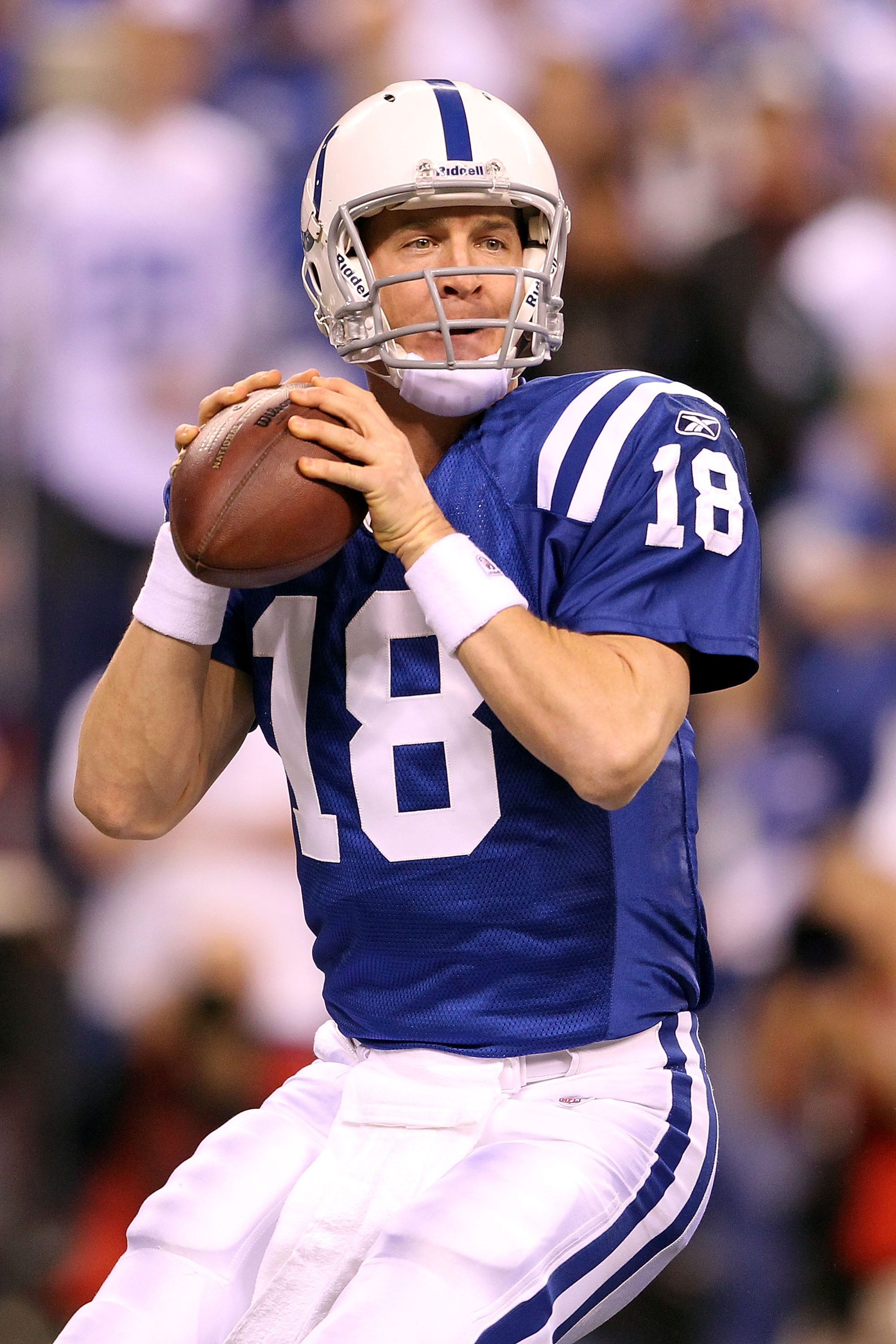 INDIANAPOLIS, IN - JANUARY 08:  Quarterback Peyton Manning #18 of the Indianapolis Colts looks to pass in the first quarter against the New York Jets during their 2011 AFC wild card playoff game at Lucas Oil Stadium on January 8, 2011 in Indianapolis, Ind