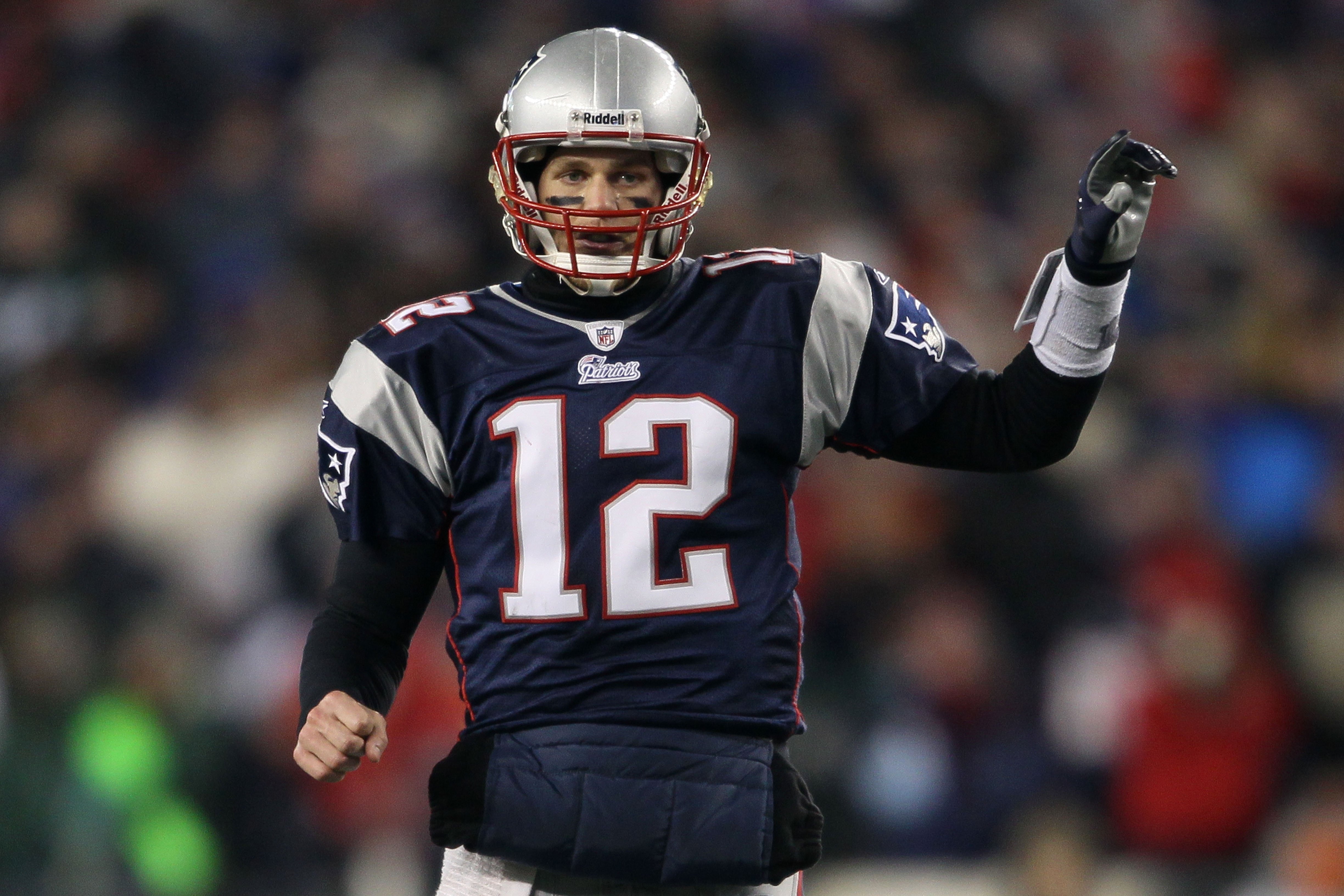 FOXBORO, MA - JANUARY 16:  Quarterback Tom Brady #12 of the New England Patriots signals during their 2011 AFC divisional playoff game against the New York Jets at Gillette Stadium on January 16, 2011 in Foxboro, Massachusetts.  (Photo by Elsa/Getty Image
