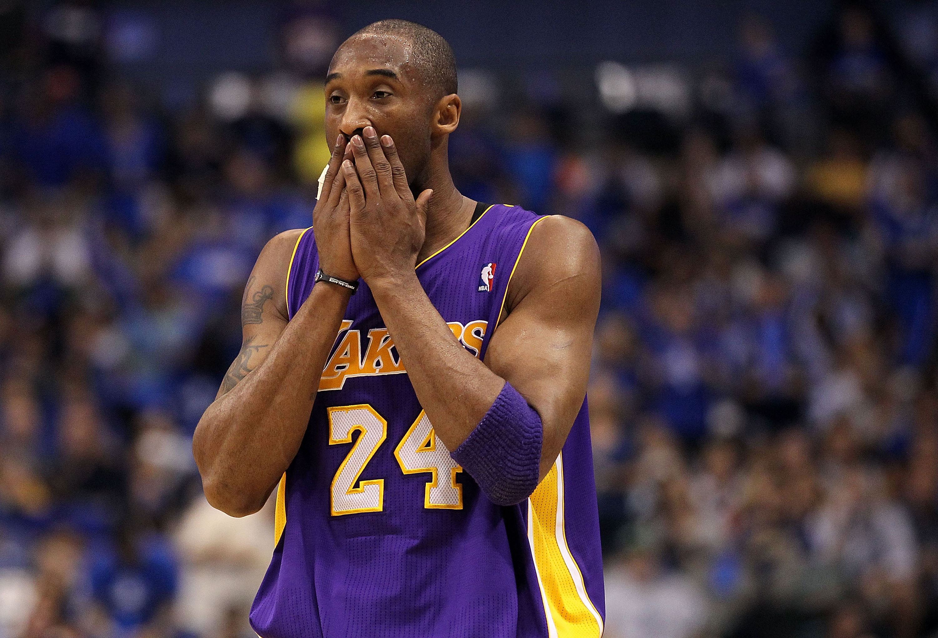 DALLAS, TX - MAY 08:  Guard Kobe Bryant #24 of the Los Angeles Lakers wipes his face during play against the Dallas Mavericks in Game Four of the Western Conference Semifinals during the 2011 NBA Playoffs on May 8, 2011 at American Airlines Center in Dall