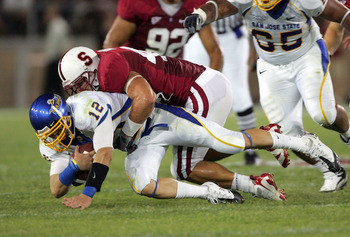 PALO ALTO, CA - SEPTEMBER 19: Jordan La Secia #12 of the San Jose State Spartans is sacked by Will Powers #42 of the Stanford Cardinal at Stanford Stadium on September 19, 2009 in Palo Alto, California. (Photo by Ezra Shaw/Getty Images)