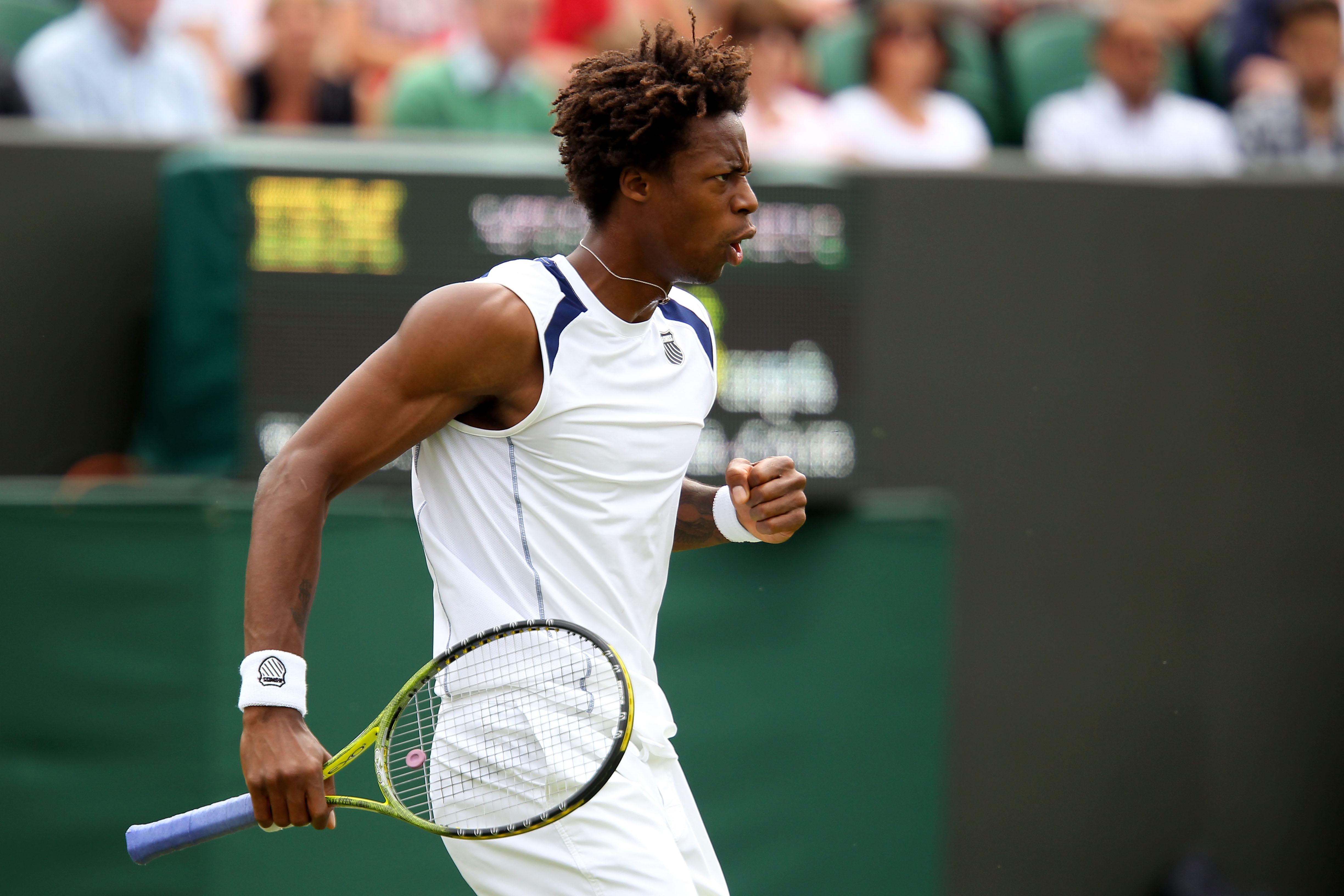 LONDON, ENGLAND - JUNE 20:  Gael Monfils of France reacts to a play during his first round match against Matthias Bachinger of Germany on Day One of the Wimbledon Lawn Tennis Championships at the All England Lawn Tennis and Croquet Club on June 20, 2011 i