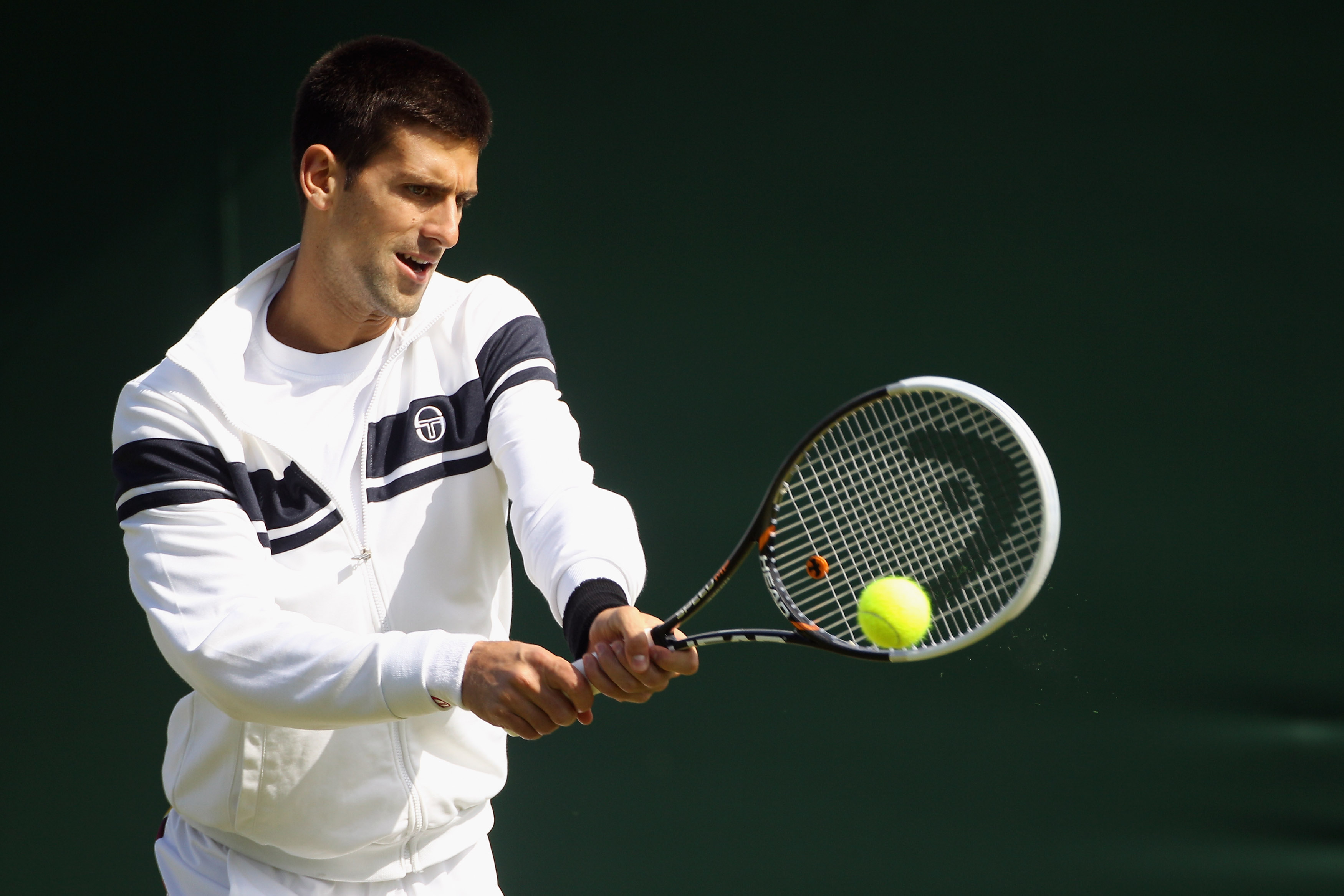 WIMBLEDON, ENGLAND - JUNE 18:  Serbian tennis player Novak Djokovic trains on court 6 at the All England Lawn Tennis and Croquet Club ahead of the Wimbledon Lawn Tennis Championships on June 18, 2011 in London, England. The Championships which are celebra