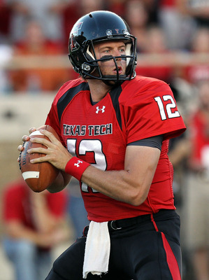 LUBBOCK, TX - SEPTEMBER 18: Quarterback Taylor Potts #12 of the Texas Tech Red Raiders drops back to pass against the Texas Longhorns at Jones AT&T Stadium on September 18, 2010 in Lubbock, Texas. (Photo by Ronald Martinez/Getty Images)