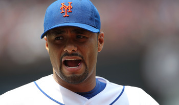 NEW YORK - JUNE 26:  Johan Santana #57 of the New York Mets walks to the dugout against the Minnesota Twins at Citi Field on June 26, 2010 in the Flushing neighborhood of the Queens borough of New York City.  (Photo by Nick Laham/Getty Images)