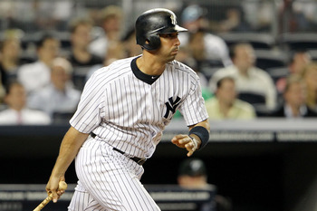 NEW YORK, NY - MAY 24:  Jorge Posada #20 of the New York Yankees hits a double in the ninth inning against the Toronto Blue Jays at Yankee Stadium on May 24, 2011 in the Bronx borough of New York City.  (Photo by Michael Heiman/Getty Images)