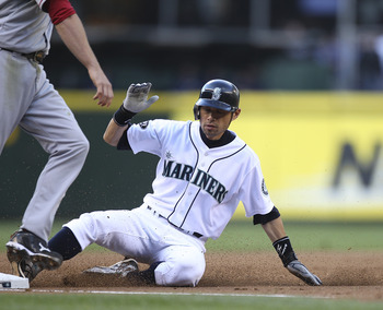 SEATTLE - JUNE 15:  Ichiro Suzuki #51 of the Seattle Mariners steals third base against the Los Angeles Angels of Anaheim at Safeco Field on June 15, 2011 in Seattle, Washington. The steal was the 400th in his Major League career. (Photo by Otto Greule Jr