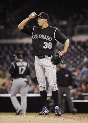 SAN DIEGO, CA - JUNE 7: Ubaldo Jimenez #38 of the Colorado Rockies looks up at the scoreboard after giving up a run in the fifthinning of a baseball game against the San Diego Padres at Petco Park on June 7, 2011 in San Diego, California.  (Photo by Denis