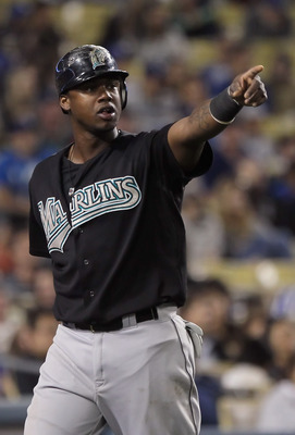 LOS ANGELES, CA - MAY 27:  Hanley Ramirez #2 of the Florida Marlins acknowledges teammate Greg Dobbs (not pictured) after Dobbs drove Ramirez in with a base hit against the Los Angeles Dodgers in the eigth inning at Dodger Stadium on May 27, 2011 in Los A