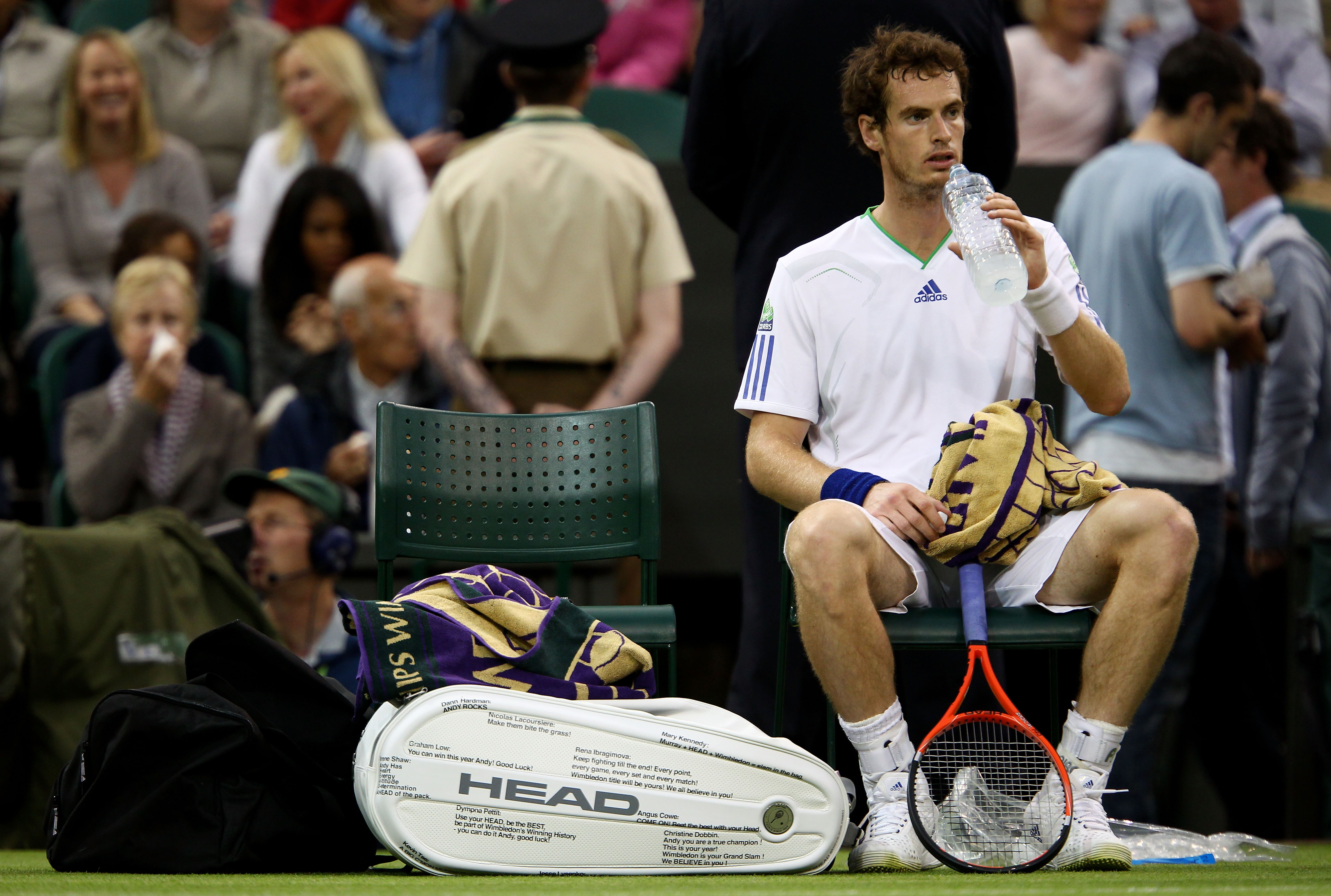 LONDON, ENGLAND - JUNE 20:  Andy Murray of Great Britain takes a break during his first round match against Daniel Gimeno-Traver of Spain on Day One of the Wimbledon Lawn Tennis Championships at the All England Lawn Tennis and Croquet Club on June 20, 201