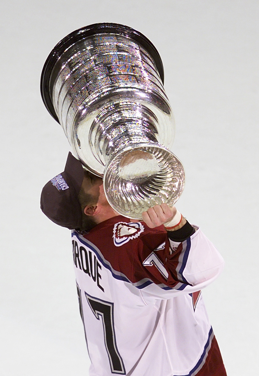 9 Jun 2001:  Ray Bourque #77 of the Colorado Avalanche kisses the Stanley Cup as an Avalanche in Denver, Colorado after 22 seasons in pursuit of the NHL Stanley Cup Championship.  DIGITAL IMAGE.  Mandatory Credit: Brian Bahr/ALLSPORT
