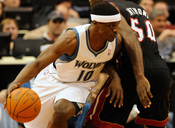 MINNEAPOLIS, MN - APRIL 1: Jonny Flynn #10 of the Minnesota Timberwolves dribbles around Joel Anthony #50 of the Miami Heat during a basketball game at Target Center on April 1, 2011 in Minneapolis, Minnesota. NOTE TO USER: User expressly acknowledges and
