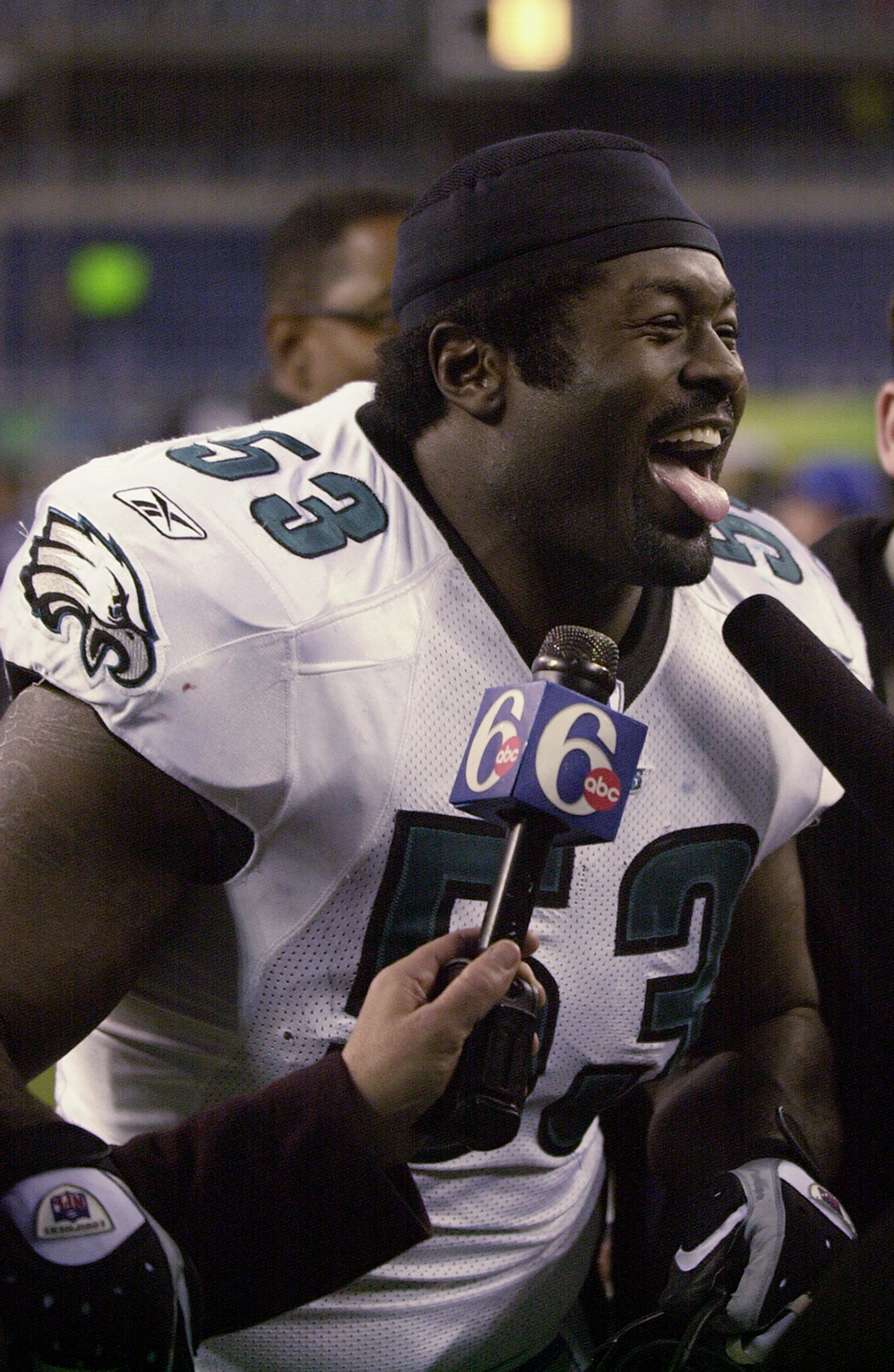 SEATTLE - DECEMBER 08:  Hugh Douglas #53 of the Philadelphia Eagles talks to the media after their NFL game against the Seattle Seahawks at Seahawks Stadium on December 08, 2002 in Seattle Washington.  The Eagles defeated the Seahawks 27-20.  (Photo by Ot