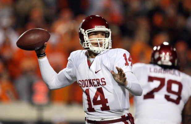 STILLWATER, OK - NOVEMBER 29:  Quarterback Sam Bradford #14 of the Oklahoma Sooners drops back to pass against the Oklahoma State Cowboys at Boone Pickens Stadium on November 29, 2008 in Stillwater, Oklahoma.  (Photo by Ronald Martinez/Getty Images)