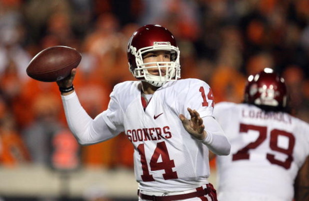 STILLWATER, OK - NOVEMBER 29: Quarterback Sam Bradford #14 of the Oklahoma Sooners drops back to pass against the Oklahoma State Cowboys at Boone Pickens Stadium on November 29, 2008 in Stillwater, Oklahoma. (Photo by Ronald Martinez/Getty Images)