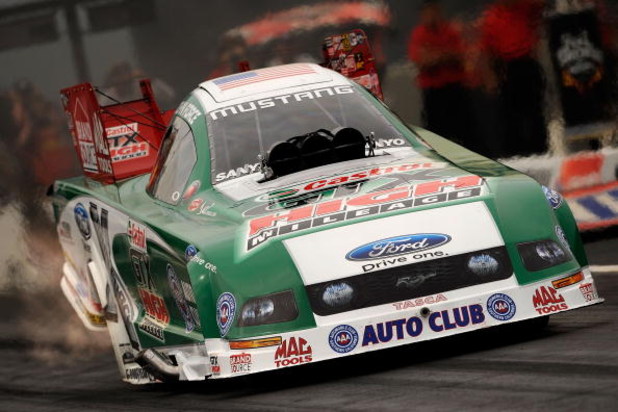 CONCORD, NC - SEPTEMBER 20:  John Force, driver of the Castrol High Mileage Ford funny car drives during the NHRA Carolinas Nationals on September 20, 2009 at Zmax Dragway in Concord, North Carolina.  (Photo by Rusty Jarrett/Getty Images)