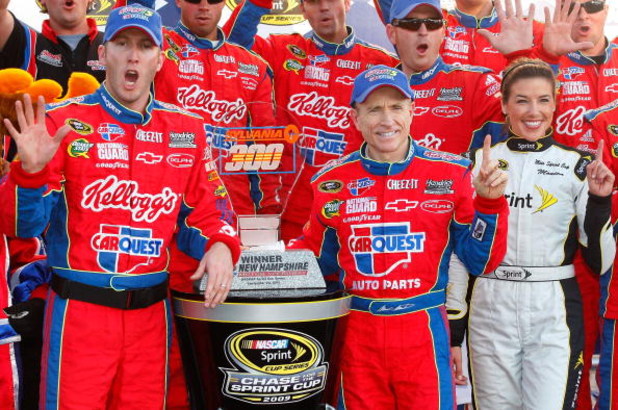 LOUDON, NH - SEPTEMBER 20:  Mark Martin, driver of the #5 CARQUEST/Kellogg's Chevrolet, celebrates with the trophy in victory lane after winning the NASCAR Sprint Cup Series Sylvania 300 at the New Hampshire Motor Speedway on September 20, 2009 in Loudon,