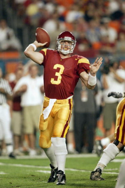 MIAMI - JANUARY 2:  Quarterback Carson Palmer #3 of USC passes against Iowa during the FedEx Orange Bowl at Pro Player Stadium on January 2, 2003 in Miami, Florida.  The University of Southern California Trojans defeated the Iowa Hawkeyes 38-17.  (Photo b