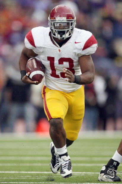 SEATTLE - SEPTEMBER 19:  Stafon Johnson #13 of the USC Trojans carries the ball during the game against the Washington Huskies on September 19, 2009 at Husky Stadium in Seattle, Washington. The Huskies defeated the Trojans 16-13. (Photo by Otto Greule Jr/