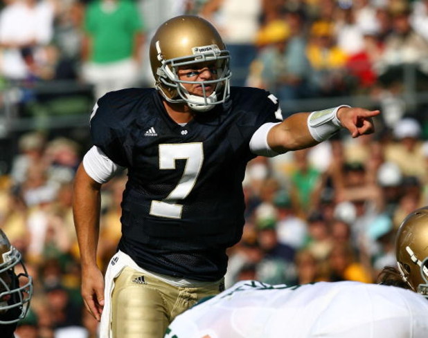 SOUTH BEND, IN - SEPTEMBER 19: Jimmy Clausen #7 of the Notre Dame Fighting Irish points out a defensive alingnment against the Michigan State Spartans on September 19, 2009 at Notre Dame Stadium in South Bend, Indiana. Notre Dame defeated Michigan State 3