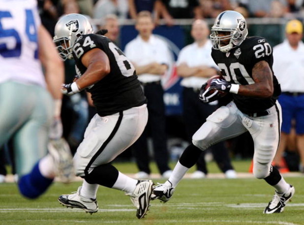 OAKLAND, CA - AUGUST 13:  Darren McFadden #20 of the Oakland Raiders runs the ball against the Dallas Cowboys during the preseason game at Oakland-Alameda County Coliseum on August 13, 2009 in Oakland, California. (Photo by Jed Jacobsohn/Getty Images)