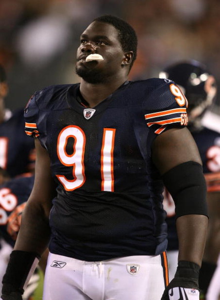 CHICAGO - AUGUST 22: Tommie Harris #91 of the Chicago Bears watches his teammates from the sidelines during a pre-season game against the New York Giants on August 22, 2009 at Soldier Field in Chicago, Illinois. The Bears defeated the Giants 17-3. (Photo 