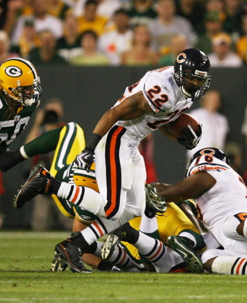 GREEN BAY, WI - SEPTEMBER 13: Matt Forte #22 of the Chicago Bears tries to gain yardage against the Green Bay Packers on September 13, 2009 at Lambeau Field in Green Bay, Wisconsin. The Packers defeated the Bears 21-15. (Photo by Jonathan Daniel/Getty Ima