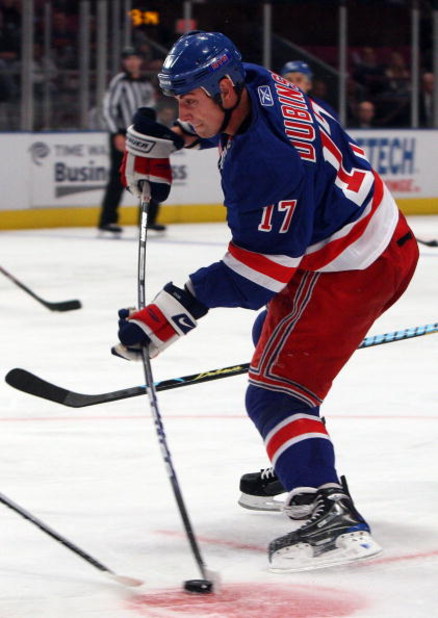 NEW YORK - SEPTEMBER 24:  Brandon Dubinsky #17 of the New York Rangers shoots the puck against the Washington Capitals during their preseason game on  September 24, 2009 at Madison Square Garden in New York City.  (Photo by Jim McIsaac/Getty Images)