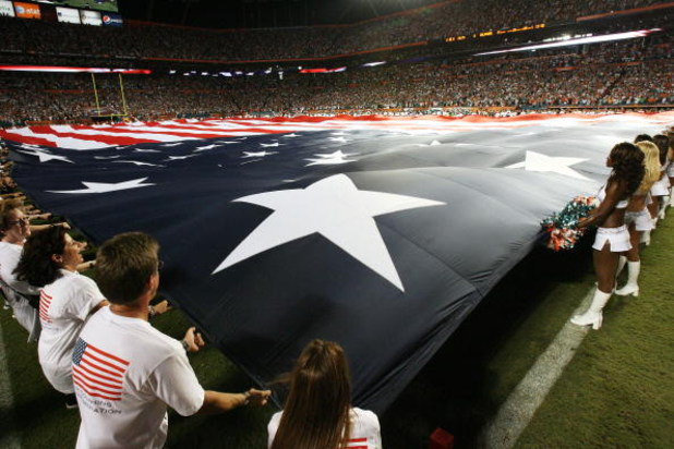 MIAMI - SEPTEMBER 21:  An American flag is spread out over the entire field before the Indianapolis Colts take on the Miami Dolphins at Land Shark Stadium on September 21, 2009 in Miami, Florida. The Colts defeated the Dolphins 27-23.  (Photo by Doug Benc