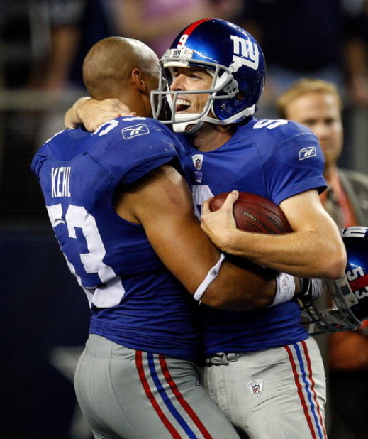 ARLINGTON, TX - SEPTEMBER 20:  Kicker Lawrence Tynes #9 and Bryan Kehl #53 of the New York Giants at Cowboys Stadium on September 20, 2009 in Arlington, Texas.  (Photo by Ronald Martinez/Getty Images)