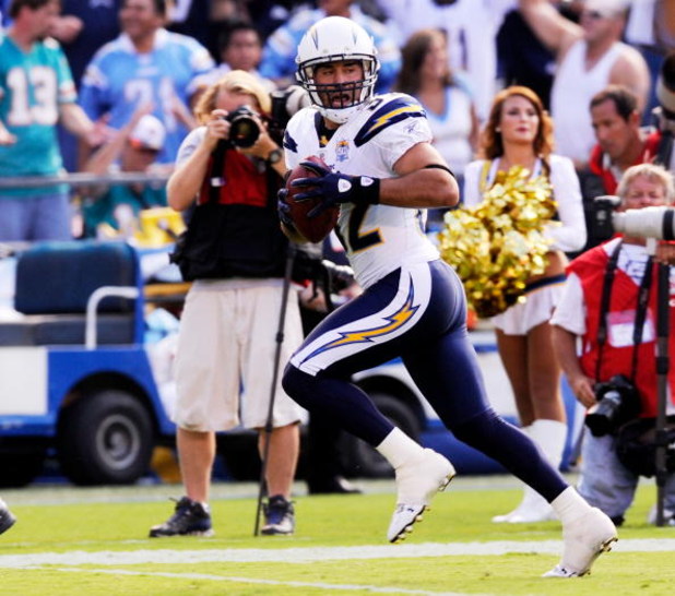 SAN DIEGO - SEPTEMBER 27:  Eric Weddle #32 of the San Diego Chargers runs back 31-yard for a touchdown after intercepting a pass by Chad Henne of the Miami Dolphins during fourth quarter of the NFL football game at Qualcomm Stadium on September 27, 2009 i