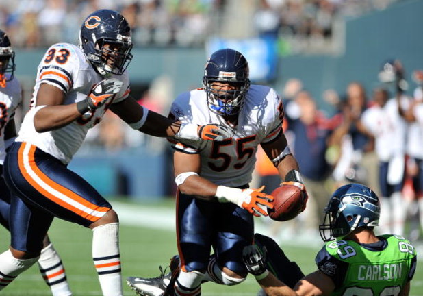 SEATTLE - SEPTEMBER 27:  Linebacker Lance Briggs #55 of the Chicago Bears and defensive end Adewale Ogunleye #93 celebrate after Briggs made an interception against John Carlson #89 of the Seattle Seahawks on September 27, 2009 at Qwest Field in Seattle, 
