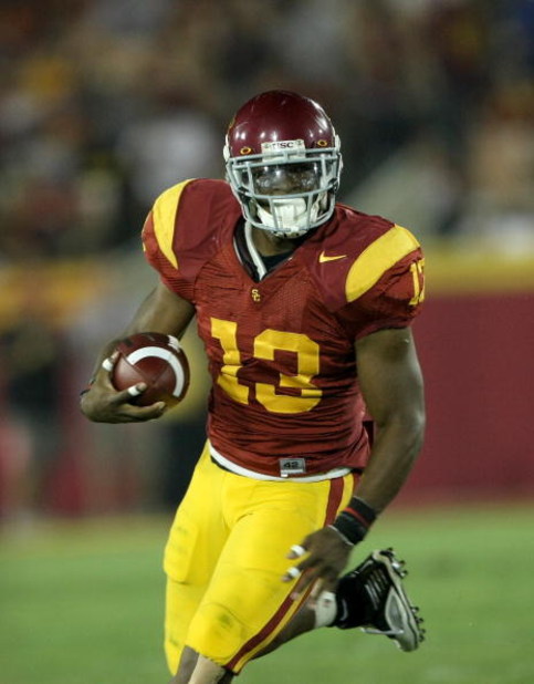 LOS ANGELES - SEPTEMBER 23:  Running back Stafon Johnson #13 of the USC Trojans carries the ball against the Washington State Cougars on September 23, 2009 at the Los Angeles Coliseum in Los Angeles, California.  USC won 27-6.   (Photo by Stephen Dunn/Get