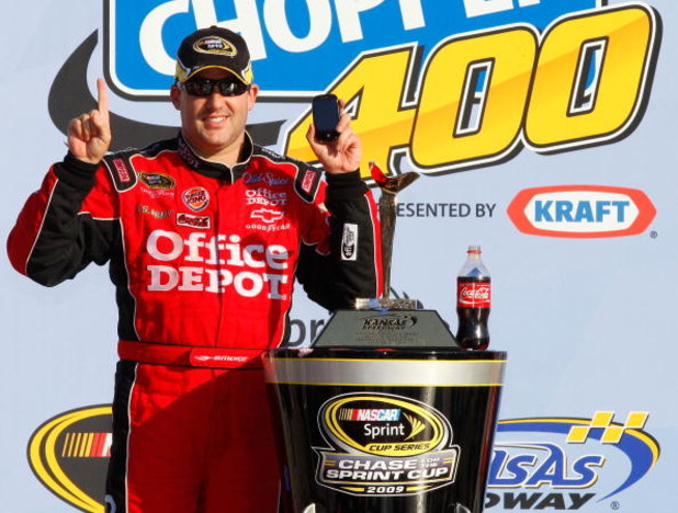 KANSAS CITY, KS - OCTOBER 04:  Tony Stewart, driver of the #14 Office Depot/Old Spice Chevrolet, celebrates after winning the NASCAR Sprint Cup Series Price Chopper 400 presented by Kraft Foods at the Kansas Speedway on October 4, 2009 in Kansas City, Kan