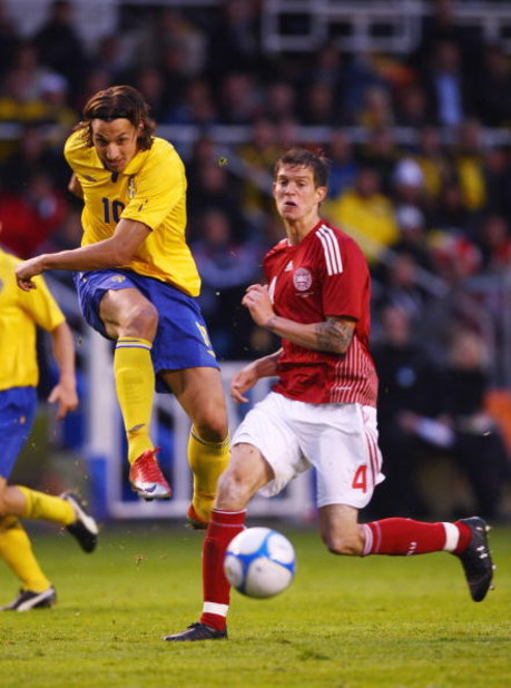 SOLNA, SWEDEN - JUNE 06:  Zlatan ibrahimovic (L) of Sweden shoots past Daniel Agger (R) of Denmark during the FIFA2010 World Cup Qualifying Group 1 match between Sweden and Denmark at the Rasunda Stadium on June 6, 2009 in Solna, Sweden.  (Photo by Michae