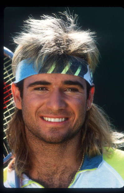 124853 01: Tennis Player Andre Agassi Smiles Holding A Racket November 15, 1991 In USA. Agassi Made His Presence Known In 1987 In The Semifinals In Stratton Mountain And Went On To Win Several Titles Including His First Grand Slam Final At The French Open
