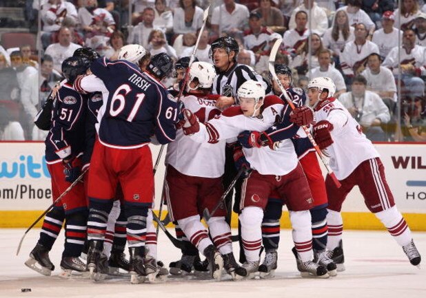 GLENDALE, AZ - OCTOBER 10: Zbynek Michalek #4 of the Phoenix Coyotes reaches over to Rick Nash #61 of the Columbus Blue Jackets during a scrum in the NHL game at Jobing.com Arena on October 10, 2009 in Glendale, Arizona. The Blue Jackets defeated the Coyo