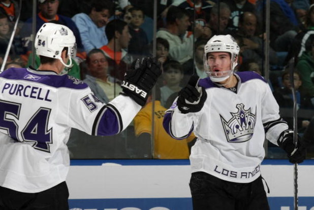 UNIONDALE, NY - OCTOBER 12: Edward Purcell #54  of the Los Angeles Kings congratulates Drew Doughty #8 on his game winning goal at 5:31 of the third period against the New York Islanders at the Nassau Coliseum on October 12, 2009 in Uniondale, New York. (