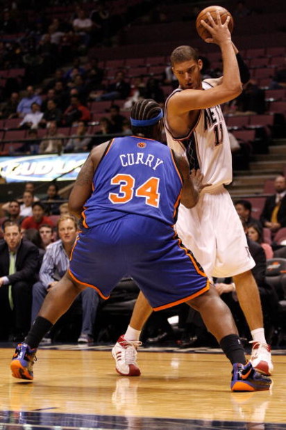EAST RUTHERFORD, NJ - OCTOBER 20:  Eddie Curry #34 of the New York Knicks defends Brook Lopez #11 of the New Jersey Nets during the second half of a pre-season game on October 20, 2008 at the IZOD Center in East Rutherford, New Jersey. The Knicks won 114-