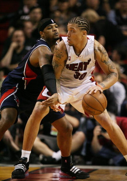 MIAMI - MAY 01:  Michael Beasley #30 of the Miami Heat backs down Josh Smith #5 of the Atlanta Hawks during Game Six of the Eastern Conference Quarterfinals at American Airlines Arena on May 1, 2009 in Miami, Florida. The Heat defeated the Hawks 98-72. NO