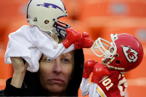 KANSAS CITY, MO - OCTOBER 25: A wet Kansas City Chiefs fans plays with puppets in the rain during the game between the San Diego Chargers and the Kansas City Chiefs on October 25, 2009 at Arrowhead Stadium in Kansas City, Missouri. (Photo by Jamie Squir