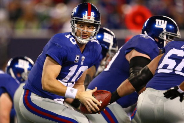 EAST RUTHERFORD, NJ - OCTOBER 25: Eli Manning #10 of the New York Giants hands off the ball against the Arizona Cardinals on October 25, 2009 at Giants Stadium in East Rutherford, New Jersey. (Photo by Chris McGrath/Getty Images)