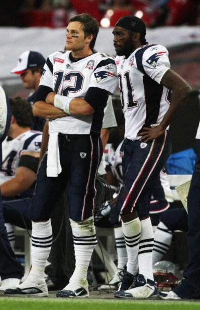 LONDON, ENGLAND - OCTOBER 25: Tom Brady (#12) and Randy Moss (#81) of the New England Patriots look on during the NFL International Series match between New England Patriots and Tampa Bay Buccaneers at Wembley Stadium on October 25, 2009 in London, Engla