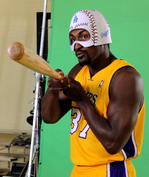 EL SEGUNDO, CA - SEPTEMBER 29: Ron Artest #37 of the Los Angeles Lakers holds a baseball bat and wears a mask while taping a public announcement for the Los Angeles Dodgers during Lakers media day at the Lakers training facility on September 29, 2009 in E