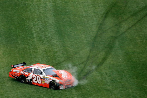 DAYTONA BEACH, FL - FEBRUARY 15: Joey Logano, driver of the #20 Home Depot Toyota, crashes during the NASCAR Sprint Cup Series Daytona 500 at Daytona International Speedway on February 15, 2009 in Daytona Beach, Florida. (Photo by Matthew Stockman/Getty